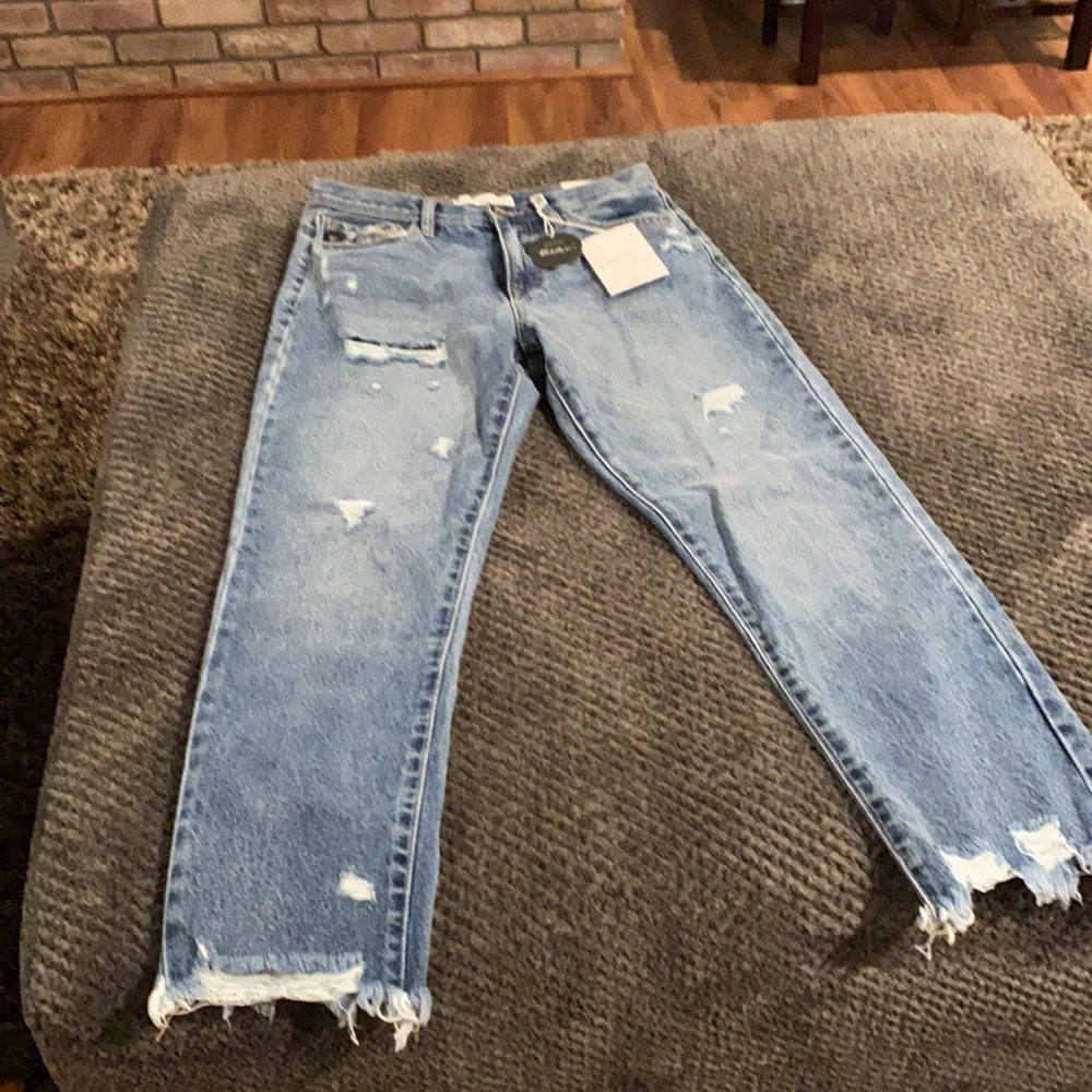 Brand new with tags distressed straight leg jeans, ankle length.  Medium wash